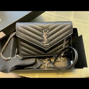 SAINT LAURENT
Black Monogram Envelope Chain Wallet Bag